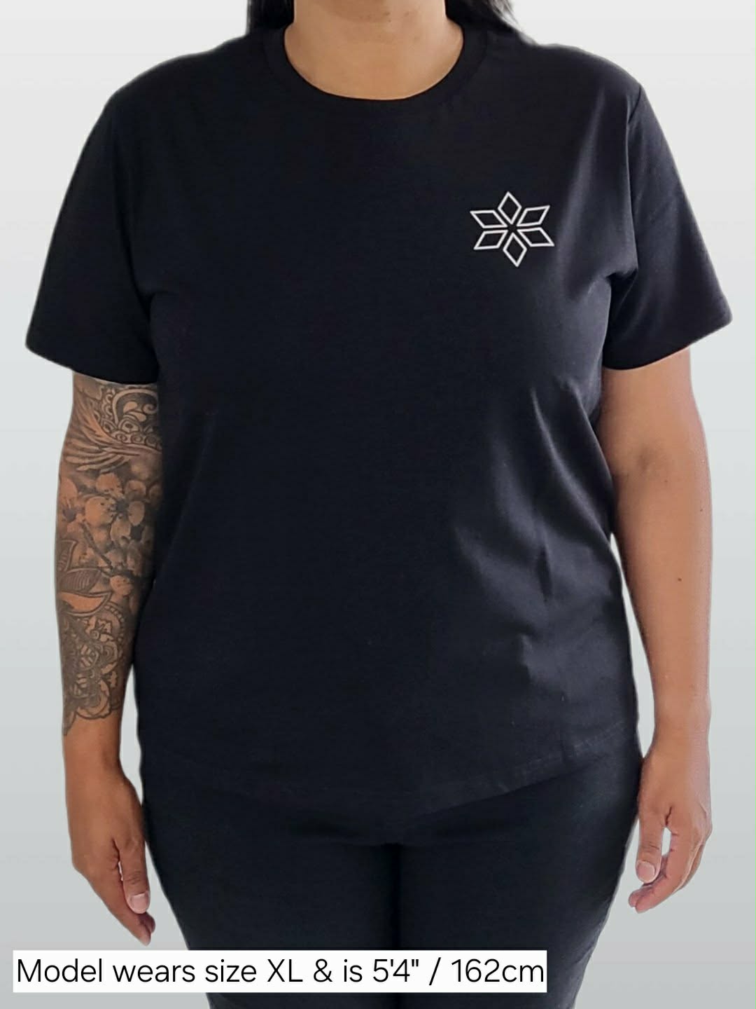 Woman wearing classic black t-shirt with star design NZ