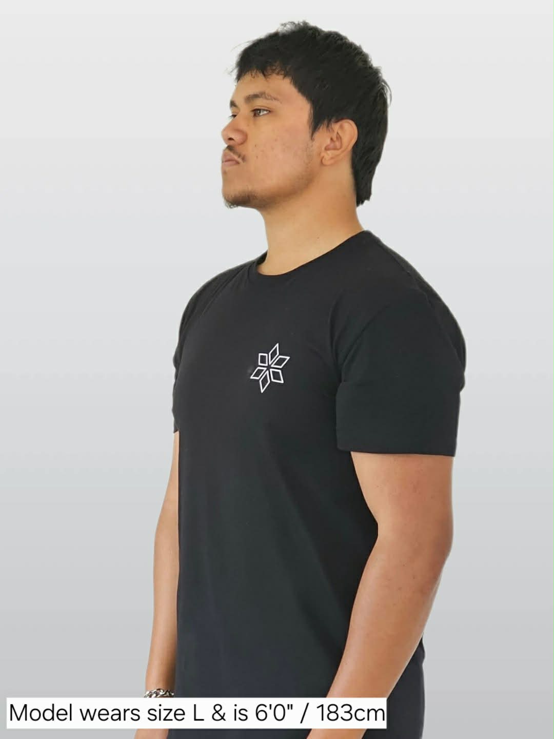 Man wearing classic black t-shirt NZ Maori star design