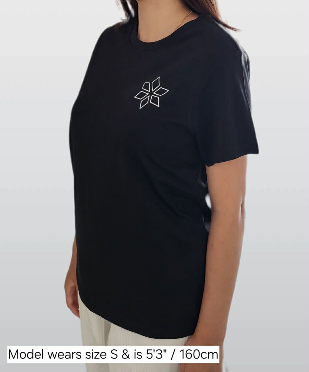 Woman wearing classic black t-shirt with star design NZ